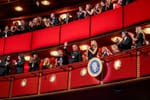 People stand in the balconies at the Kennedy Center