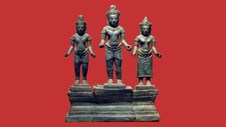 Khmer bronze “Shiva Triad” sculpture with three standing figures on a shared stepped base, digitally placed against a red background.