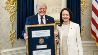 President Donald Trump meets with Venezuelan opposition leader Maria Corina Machado in the Oval Office, holding her Nobel Peace Prize medal