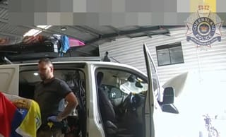 police are pictured recovering artifacts from a camper van