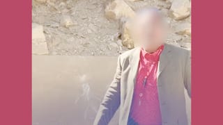 A tour guide and chalk drawings are seen on a pyramid in egypt