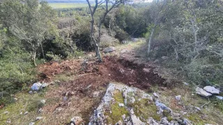 An illegal dig site is pictured in Greece