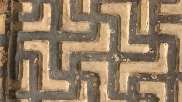 Ancient polychrome terracotta relief fragment with geometric pattern, looted from a Phrygian temple in Turkey and repatriated by the Virginia Museum of Fine Arts.