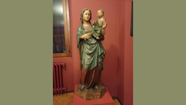 A painted wooden Medieval sculpture of the "Madonna and Child" 